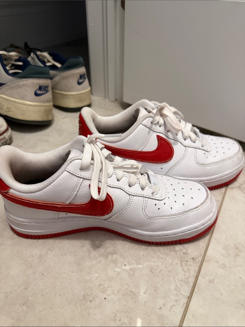 Nike Kids White Sneakers with Red Swoosh